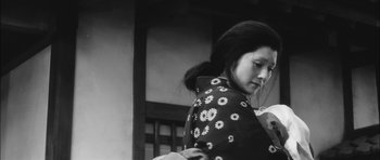 Movie still from “Samurai Rebellion” (1967), directed by Masaki Kobayashi – A young woman in a black and white photo; Close Up shot, Low angle
