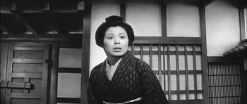 Movie still from “Samurai Rebellion” (1967), directed by Masaki Kobayashi – An old photo of an asian woman in a kimono; Medium shot, Low angle