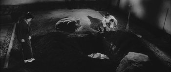 Movie still from “Samurai Rebellion” (1967), directed by Masaki Kobayashi – A man kneeling down next to a child; Extreme Wide shot, High angle