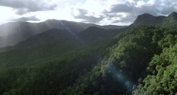 Movie still from “Sanctum” (2011), directed by Alister Grierson – A view of a mountain range from a helicopter; Extreme Wide shot, High angle