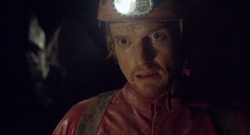 Movie still from “Sanctum” (2011), directed by Alister Grierson – A person with a helmet on; Close Up shot, Over the shoulder angle