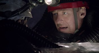 Movie still from “Sanctum” (2011), directed by Alister Grierson – A person with a helmet on; Close Up shot, Low angle