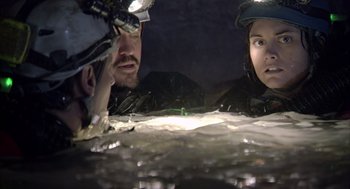 Movie still from “Sanctum” (2011), directed by Alister Grierson – A man and a woman in the water looking at each other; Close Up shot, Low angle