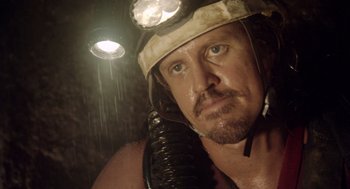 Movie still from “Sanctum” (2011), directed by Alister Grierson – A person with a helmet on; Close Up shot, Low angle