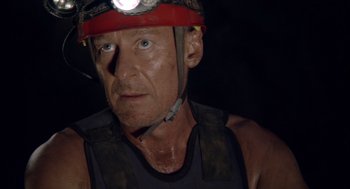 Movie still from “Sanctum” (2011), directed by Alister Grierson – A person with a helmet on; Close Up shot, Low angle