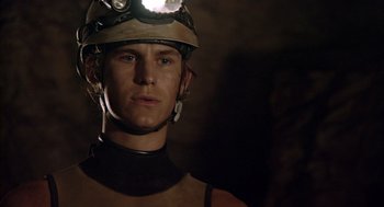 Movie still from “Sanctum” (2011), directed by Alister Grierson – A man with a helmet on his head; Close Up shot, Low angle