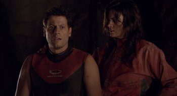 Movie still from “Sanctum” (2011), directed by Alister Grierson – A man and a woman standing next to each other; Medium shot, Over the shoulder angle