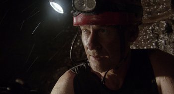Movie still from “Sanctum” (2011), directed by Alister Grierson – A person with a helmet on; Close Up shot, Low angle