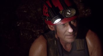 Movie still from “Sanctum” (2011), directed by Alister Grierson – A person wearing a helmet; Close Up shot, Overhead angle