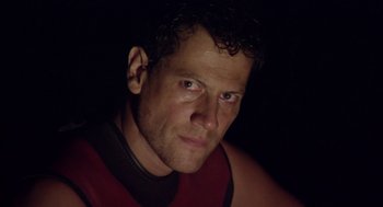 Movie still from “Sanctum” (2011), directed by Alister Grierson – A person wearing a red and black shirt; Close Up shot, Low angle