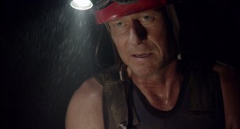 Movie still from “Sanctum” (2011), directed by Alister Grierson – A person with a helmet on; Close Up shot, Low angle