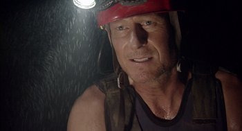 Movie still from “Sanctum” (2011), directed by Alister Grierson – A person wearing a hard hat; Close Up shot, Low angle