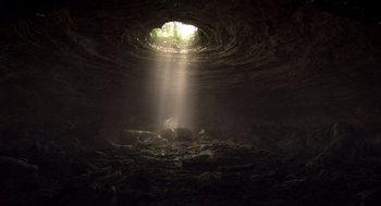 Movie still from “Sanctum” (2011), directed by Alister Grierson – A light shining through a hole in a cave; Extreme Wide shot, Low angle