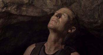 Movie still from “Sanctum” (2011), directed by Alister Grierson – A person looking up at the sky; Close Up shot, Low angle