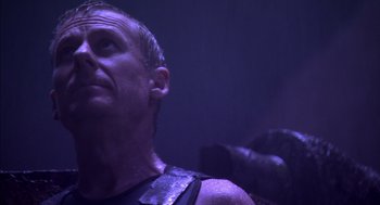 Movie still from “Sanctum” (2011), directed by Alister Grierson – A person wearing a leather vest; Close Up shot, Low angle