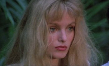 Movie still from “Sans Soleil” (1983), directed by Chris Marker – A person with long blonde hair; Close Up shot, Low angle