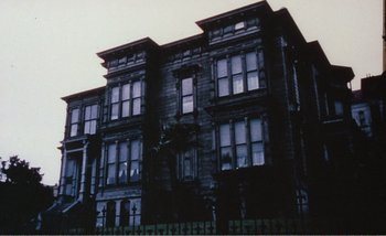 Movie still from “Sans Soleil” (1983), directed by Chris Marker – A large building with many windows on the outside; Extreme Wide shot, Low angle