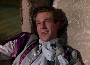 Movie still from “Saraband” (1948), directed by Basil Dearden – A person sitting on a chair; Close Up shot, High angle