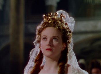Movie still from “Saraband” (1948), directed by Basil Dearden – A young woman wearing a crown and a veil; Close Up shot, Low angle