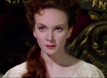 Movie still from “Saraband” (1948), directed by Basil Dearden – A person with long hair; Close Up shot, High angle