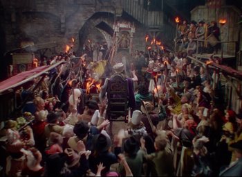 Movie still from “Saraband” (1948), directed by Basil Dearden – A large crowd of people gathered in a building; Extreme Wide shot, High angle