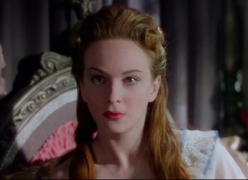 Movie still from “Saraband” (1948), directed by Basil Dearden – A beautiful young woman with long red hair and blue eyes; Close Up shot, Over the shoulder angle