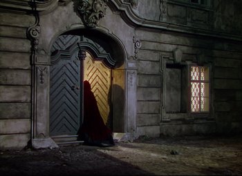 Movie still from “Saraband” (1948), directed by Basil Dearden – An image of an open door in a building; Wide shot, High angle