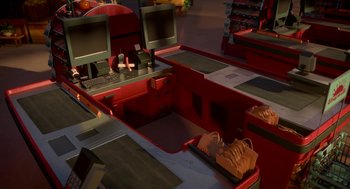 Movie still from “Sausage Party” (2016), directed by Greg Tiernan – A computer desk that has two computers on top of it; Wide shot, High angle