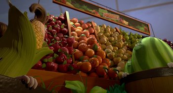 Movie still from “Sausage Party” (2016), directed by Greg Tiernan – An assortment of fruits on display at a market; Medium shot, Over the shoulder angle