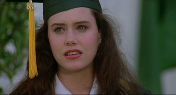 Movie still from “Say Anything” (1989), directed by Cameron Crowe – A person wearing a hat; Close Up shot, Over the shoulder angle