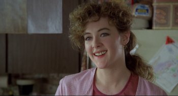Movie still from “Say Anything” (1989), directed by Cameron Crowe – A person smiling; Close Up shot, Over the shoulder angle