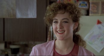 Movie still from “Say Anything” (1989), directed by Cameron Crowe – A person smiling; Close Up shot, Over the shoulder angle