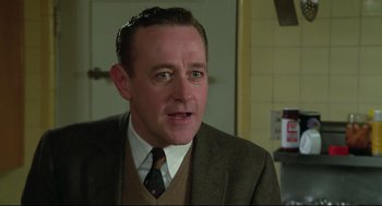 Movie still from “Say Anything” (1989), directed by Cameron Crowe – A person wearing a suit and tie; Close Up shot, Low angle