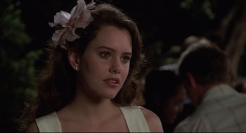 Movie still from “Say Anything” (1989), directed by Cameron Crowe – A person with a flower in her hair; Close Up shot, Over the shoulder angle