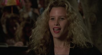 Movie still from “Say Anything” (1989), directed by Cameron Crowe – A person with curly hair; Close Up shot, Over the shoulder angle