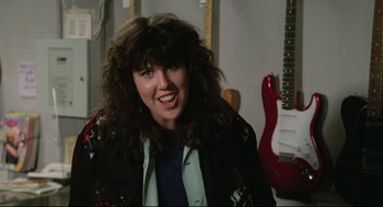 Movie still from “Say Anything” (1989), directed by Cameron Crowe – A person with a guitar; Close Up shot, Over the shoulder angle