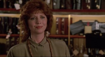 Movie still from “Say Anything” (1989), directed by Cameron Crowe – A person wearing a necklace; Close Up shot, Over the shoulder angle