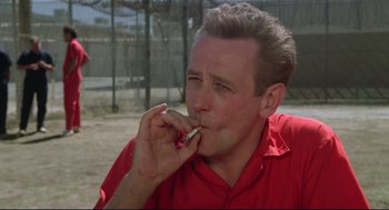 Movie still from “Say Anything” (1989), directed by Cameron Crowe – A person eating a piece of food; Close Up shot, Low angle