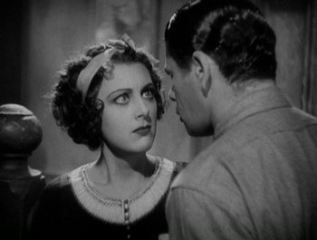 Movie still from “Scarface” (1932), directed by Richard Rosson – An old black and white photo of a man and a woman looking at each other; Close Up shot, Over the shoulder angle