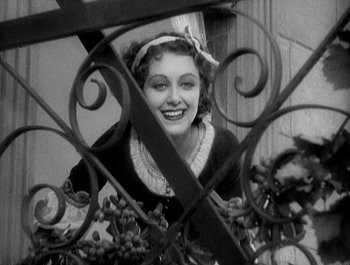 Movie still from “Scarface” (1932), directed by Richard Rosson – An old black and white photo of a woman; Close Up shot, Low angle