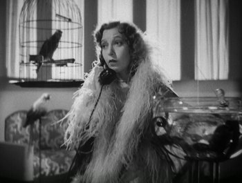 Movie still from “Scarface” (1932), directed by Richard Rosson – An old photo of a woman talking on a phone; Close Up shot, High angle