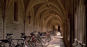 Movie still from “Scent of a Woman” (1992), directed by Martin Brest – Many bicycles are lined up in a row in a hallway; Extreme Wide shot, High angle