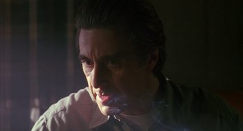 Movie still from “Scent of a Woman” (1992), directed by Martin Brest – A person smoking a cigarette; Close Up shot, Low angle