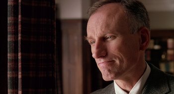 Movie still from “Scent of a Woman” (1992), directed by Martin Brest – A person wearing a suit and tie; Close Up shot, Low angle