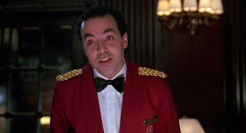 Movie still from “Scent of a Woman” (1992), directed by Martin Brest – A man in a red jacket and a black bow tie; Close Up shot, Low angle