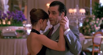 Movie still from “Scent of a Woman” (1992), directed by Martin Brest – A man and a woman are dancing together; Medium shot, Low angle
