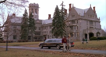 Movie still from “Scent of a Woman” (1992), directed by Martin Brest – Two men standing in front of a large building; Extreme Wide shot, High angle