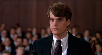 Movie still from “Scent of a Woman” (1992), directed by Martin Brest – A man in a suit and tie in front of an audience; Close Up shot, High angle