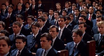 Movie still from “Scent of a Woman” (1992), directed by Martin Brest – A group of men in suits and ties sitting in a room; Medium shot, High angle