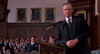 Movie still from “Scent of a Woman” (1992), directed by Martin Brest – A man standing at a podium in front of a crowd; Medium shot, Low angle